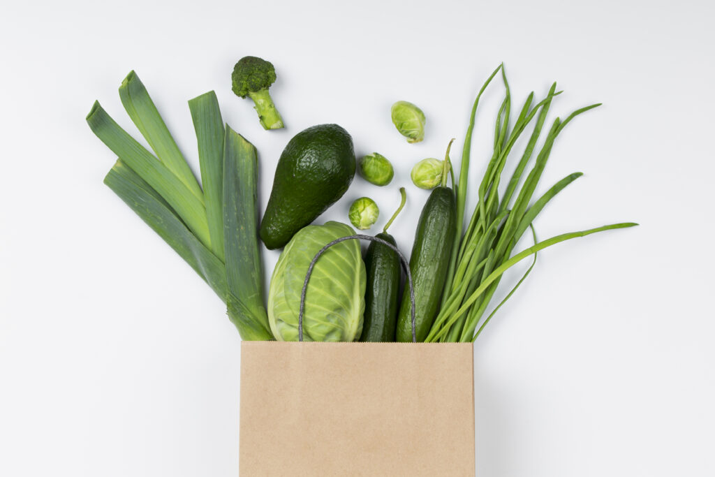 top-view-green-vegetables-paper-bag
